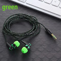 Green 3.5mm Wired In-ear Stereo Bass Earphone Nylon Weave Cable with active noise-cancellation lying on a desk next to a keyboard.