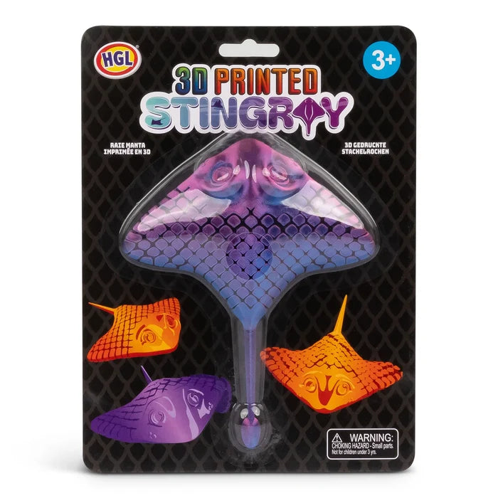 Purple and blue 3D printed stingray fidget toy in a black blister pack with orange and purple stingray illustrations.