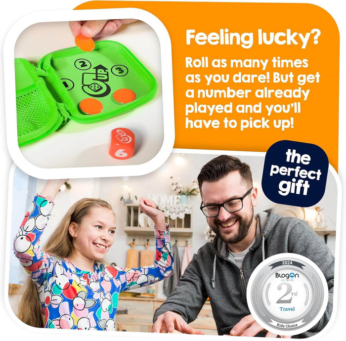 Man and girl play a dice game with a green zip case, orange tokens, and red die. 2024 Travel Toy award seal in corner.
