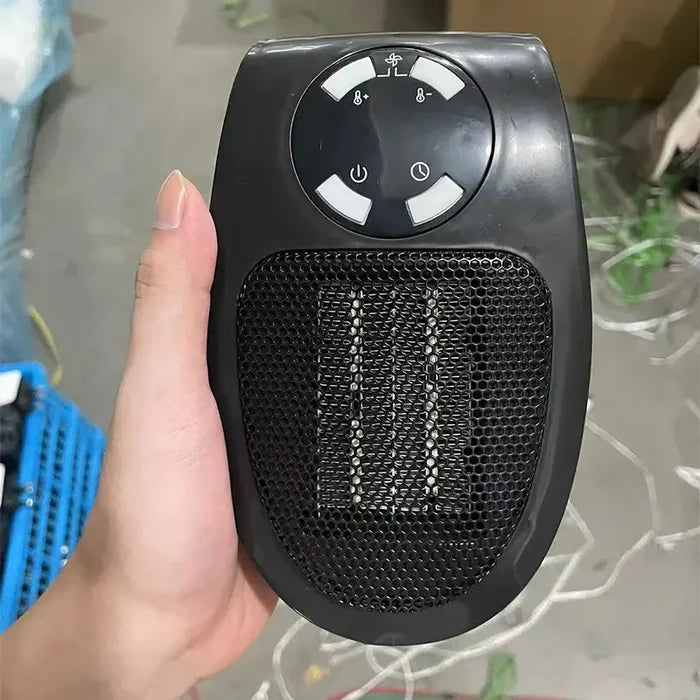 Hand holding a LZHZXY MUG-16 model 500W Fan Heater Mini Electric Space Heater with CE certification in a workshop setting.