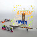 Clear LED board on a stand with colorful markers and a handwritten TAKE ACTION make it HAPPEN message and stars.