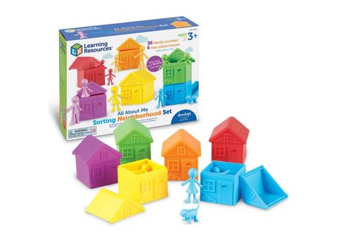 Boxed set with 6 colorful two-piece houses and matching family figures in red, orange, yellow, green, blue, and purple.