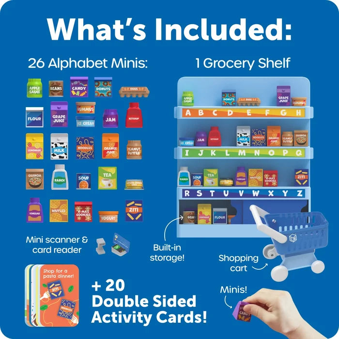 Blue promotional graphic showing the contents of a toy grocery store set: 26 alphabet minis, 1 grocery shelf, a mini scanner and card reader, a shopping cart, and double-sided activity cards. A hand is holding a mini item at the lower right.