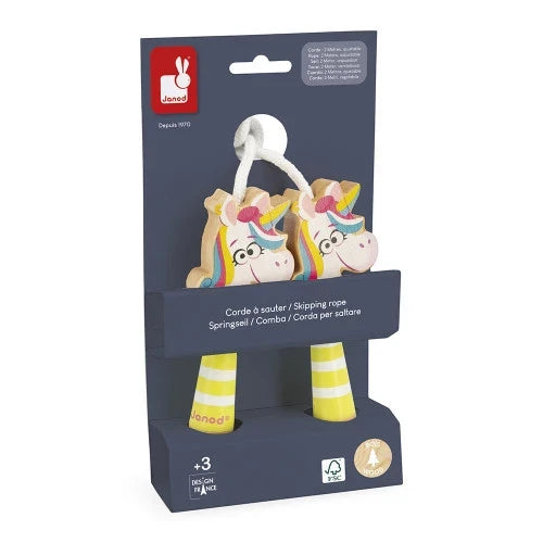 Janod wooden skipping rope with yellow striped handles and colorful unicorn heads, on dark blue cardboard packaging.