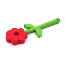Red flower-shaped chew toy with a long green stem handle, two small leaves, and a lanyard hole at the end.