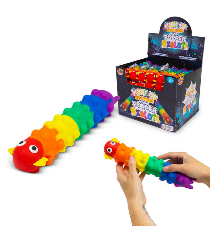 Segmented rainbow axolotl fidget toy with suction cup bubbles, shown with its display box and held by hands.