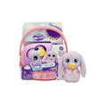 Plush purple bunny with big blue eyes and yellow pacifier next to its pink and purple toy carrier packaging.