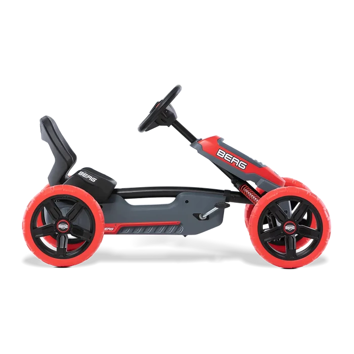 Red and grey pedal go-kart with chunky red wheels, a black bucket seat, and a steering wheel.