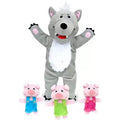 Grey wolf hand puppet with white belly and three small pink pig finger puppets wearing blue, green, and pink overalls.