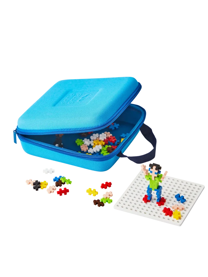 Open blue zippered case with colorful plus-shaped blocks and a small figure built on a white grid baseplate.