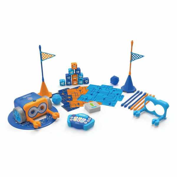 Blue and orange robot toy with big eyes, remote, blocks, flags, and coding tiles spread on a white background.