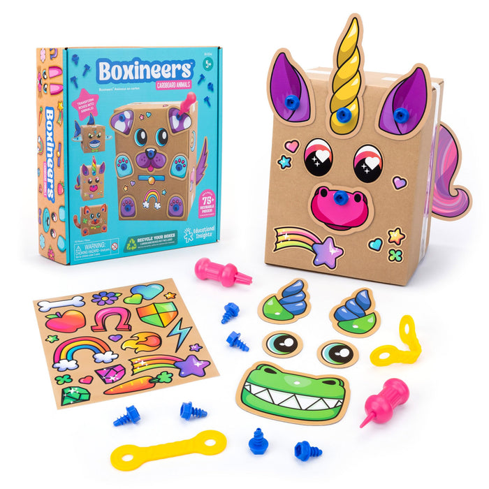 Boxineers craft kit featuring a cardboard unicorn, teal box, colorful stickers, blue plastic screws, and pink tools.