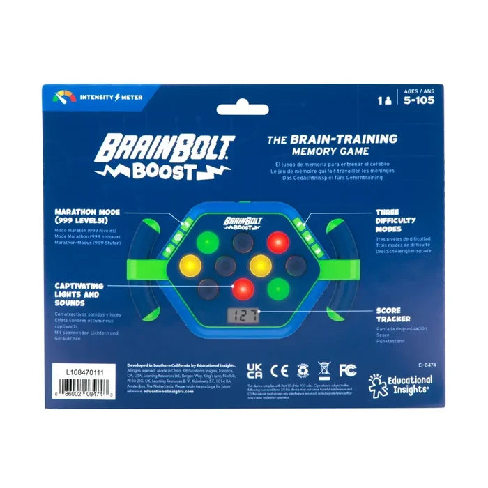 Handheld memory game in blue packaging with green handles, colorful light-up buttons, and a digital score screen.