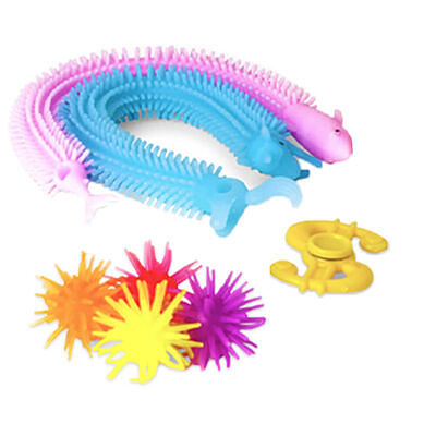 Three pink and blue stretchy caterpillars, four colorful spiky balls, and a yellow fidget spinner on white.