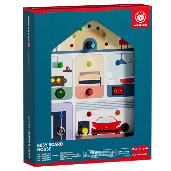 House-shaped wooden activity toy in a blue box featuring colorful switches, buttons, and illustrated room scenes.