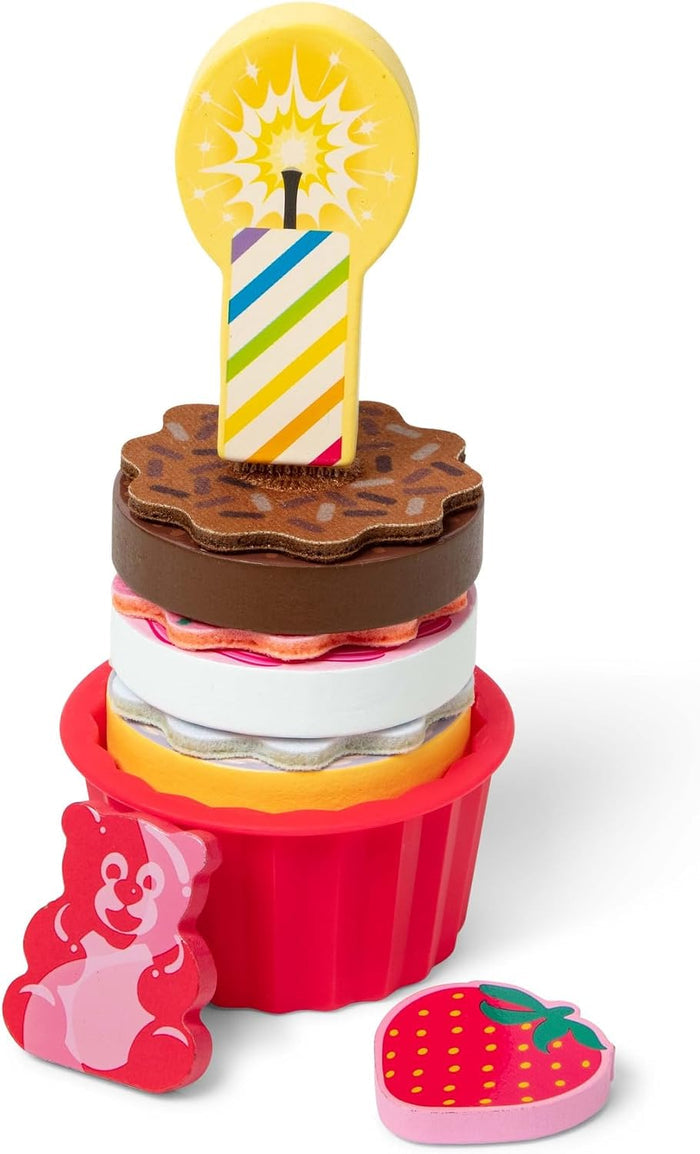 Colorful stacked wooden cupcake toy with a striped candle, pink bear shape, and strawberry piece.