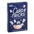 Dark blue box for Professor Puzzle Card Tricks featuring white stars and illustrations of floating playing cards.