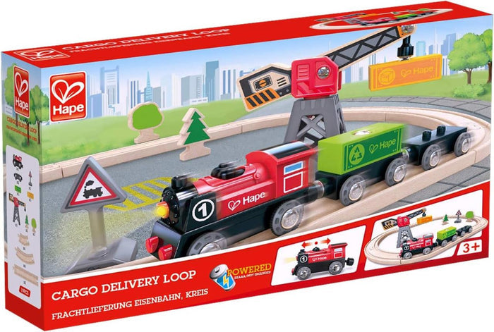 Hape Cargo Delivery Loop box showing a red battery-powered train, wooden tracks, and a gray crane lifting a yellow block.