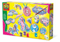 Yellow box showing glittery unicorn and rainbow plaster figures, paint pots, glitter glue, and a paintbrush.