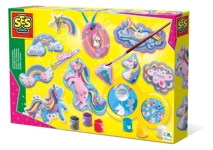 Yellow box showing glittery unicorn and rainbow plaster figures, paint pots, glitter glue, and a paintbrush.