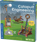 STEM kit box showing orange and brown plastic models of a trebuchet, crossbow, and onager with target blocks.