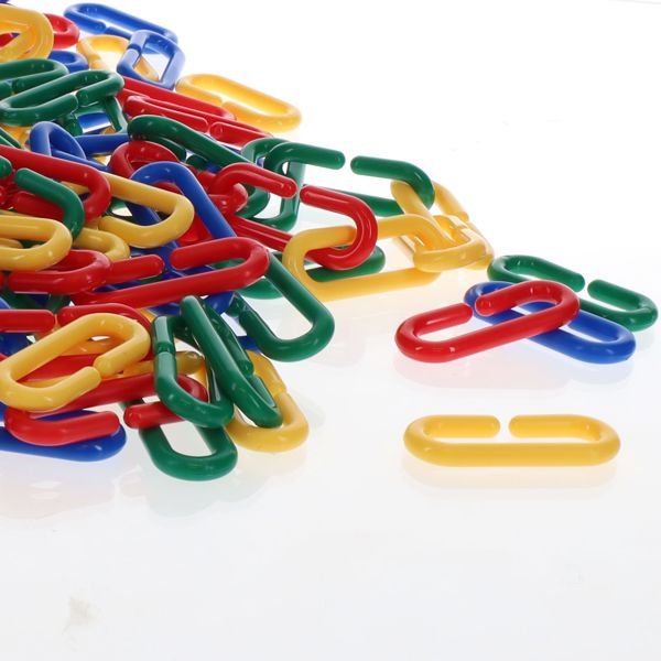 Colorful red, blue, yellow, and green plastic oval links with gaps for connecting on a white background.