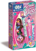 Pink box for a Clementoni Create Your Pens kit, featuring three mermaid-themed pens and DIY craft components.