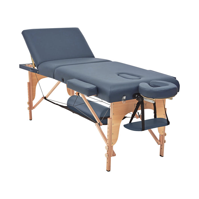 A portable massage table with navy blue upholstery, including side arm rests and a face cradle, set up for use.