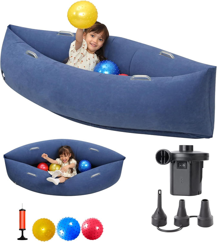 Child playing in a blue inflatable sensory pod with colorful balls, plus manual and electric air pumps.