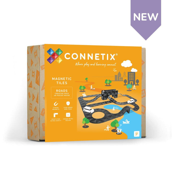 Orange box showing black magnetic road tiles in a winding track with toy cars, trees, and a purple NEW banner.