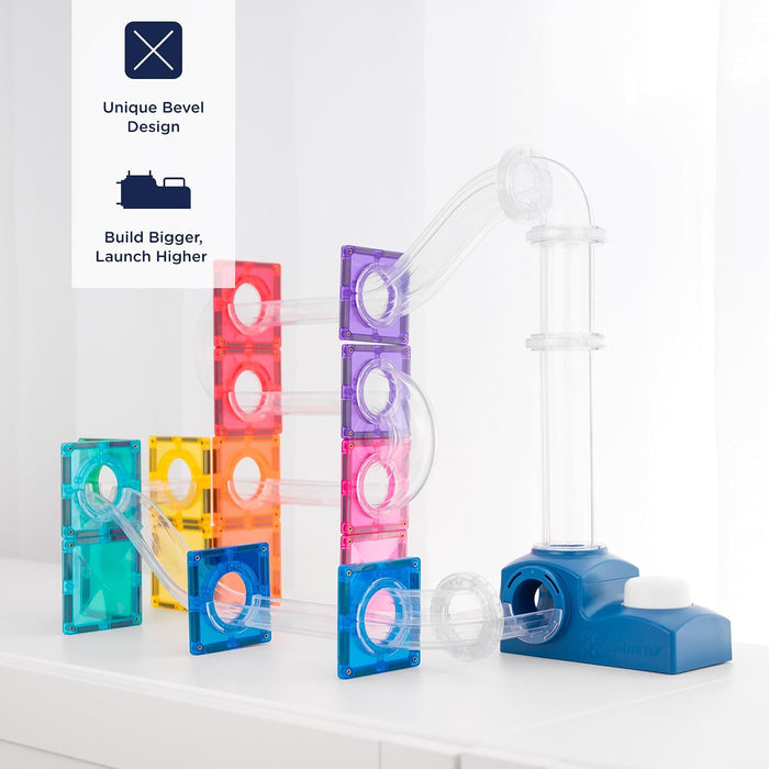 Rainbow magnetic tile marble run with clear plastic tubes and a blue launcher base.