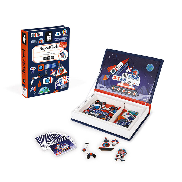 Dark blue book-shaped magnetic space toy featuring rocket and astronaut pieces, cards, and an illustrated play board.