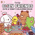 Pink cover of the Cozy Friends colouring book featuring a bear, frog, dog, and chick playing a board game.