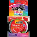 A tin of red Crazy Aaron's Thinking Putty labeled Flowing Lava next to its colorful rainbow packaging.