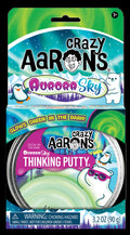 Packaging for Aurora Sky Thinking Putty featuring a polar bear with sunglasses and a penguin against a northern lights sky.