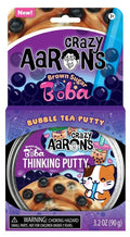 Crazy Aaron's Brown Sugar Boba Thinking Putty packaging and tin showing brown putty with black boba-style beads.