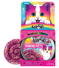 Sparkly purple Thinking Putty swirl next to pink kitten-themed packaging featuring a colorful cartoon cat.