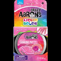 Pink packaging for Crazy Aaron's Rose Lagoon Thinking Putty, featuring a tin with a seashell and rose graphic.