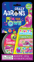 Crazy Aaron's Mix Your Own Fruity Smoothy Thinking Putty kit with purple putty and fruit-shaped charms.