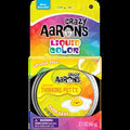 Yellow Crazy Aaron's Over Easy Thinking Putty in a metal tin with egg graphic and Liquid Color packaging.