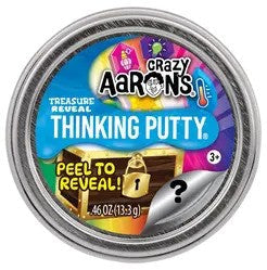 A circular silver tin of Crazy Aaron's Treasure Reveal Thinking Putty with a colorful label featuring a treasure chest.