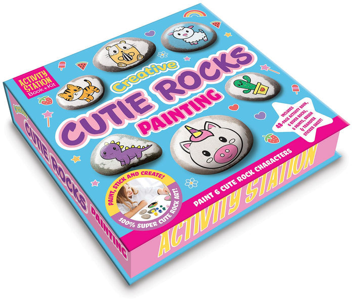 Blue and pink rock painting kit box featuring cute animal-themed stone illustrations like a unicorn, dinosaur, and tiger.