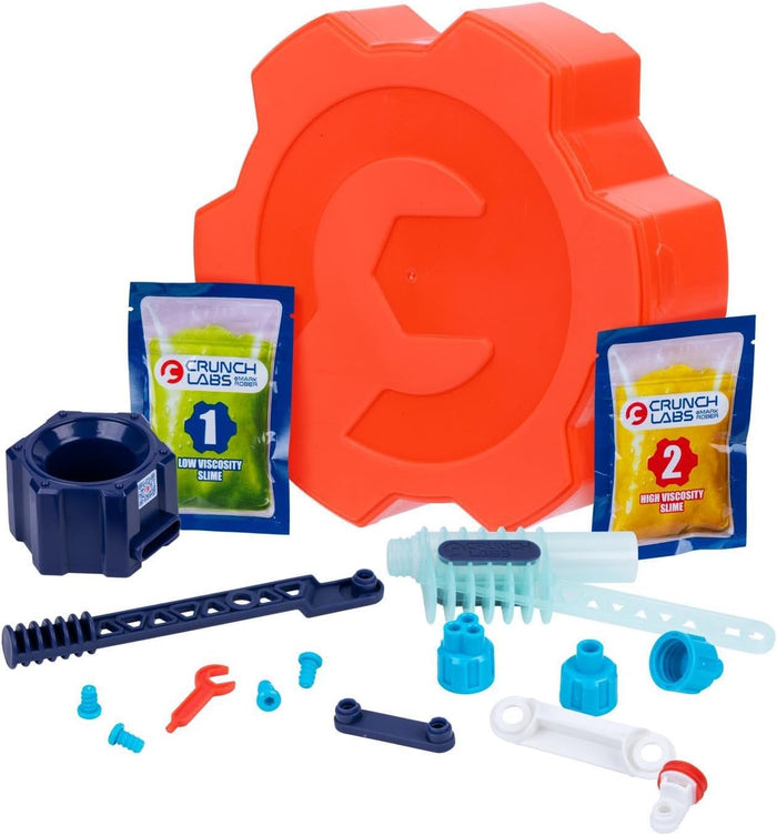 Orange gear-shaped case with green and yellow slime pouches and various blue, red, and white plastic building parts.