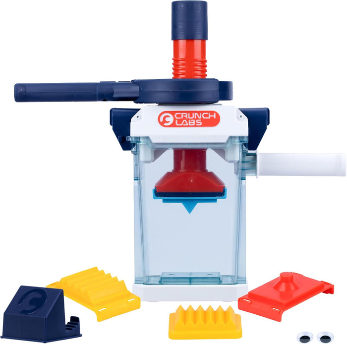 Crunch Labs toy press with clear container, blue handle, red plunger, yellow plates, and googly eyes.