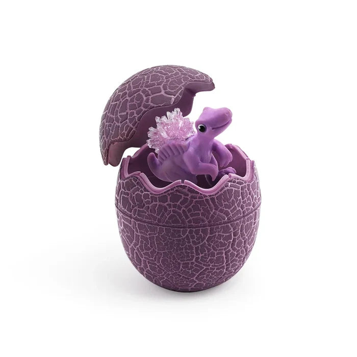 Small purple dinosaur with pink crystals on its back, inside an open, textured purple egg.