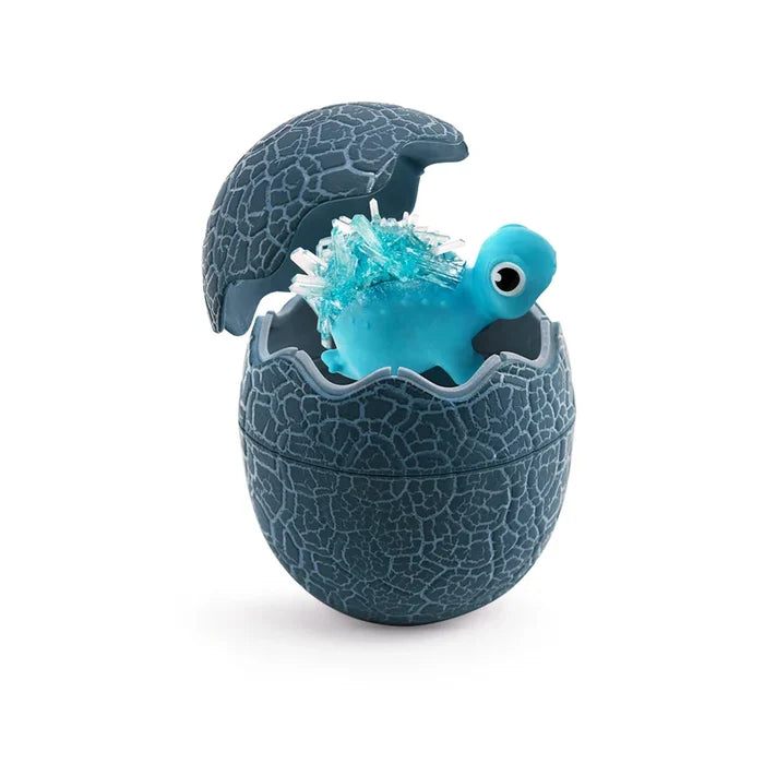 Blue dinosaur with blue crystal growths on its back inside a cracked, textured dark grey egg.