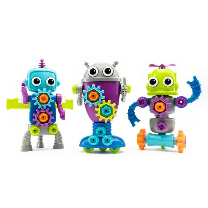 Three colorful toy robots with large eyes, gears, and bolts in bright blue, purple, green, and silver.