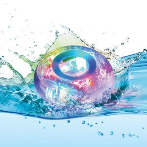Multi-colored circular bath light splashing in blue water, glowing with vibrant pink, purple, and blue hues.