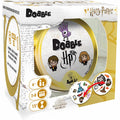 White and gold Harry Potter Dobble game box featuring a round gold tin with cartoon Harry and Hermione.