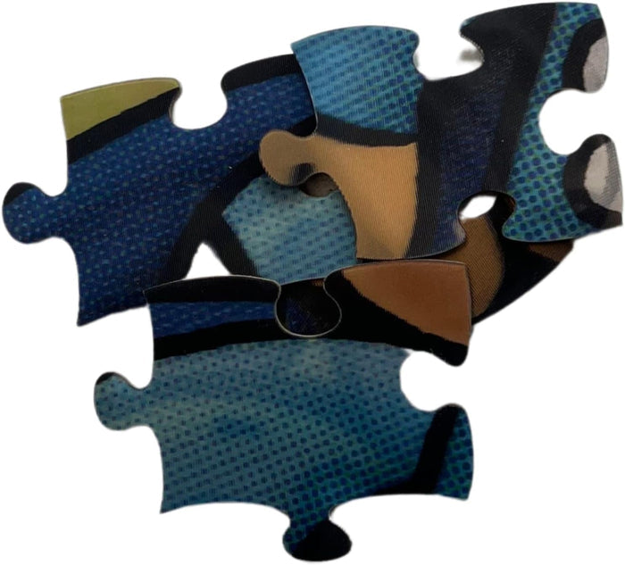 Close-up of blue comic-style puzzle pieces with a halftone dot pattern, thick black outlines, and brown accents.